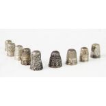 A collection of silver thimbles, to include, five Charles Horner examples, a commemorative example