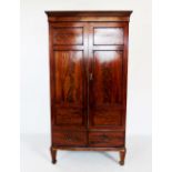 A 19th century mahogany two door wardrobe, with a moulded cornice above a plain frieze and a pair of
