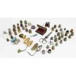 A collection of 19th century and later sewing items, to include, two yellow metal bobbin cases, each