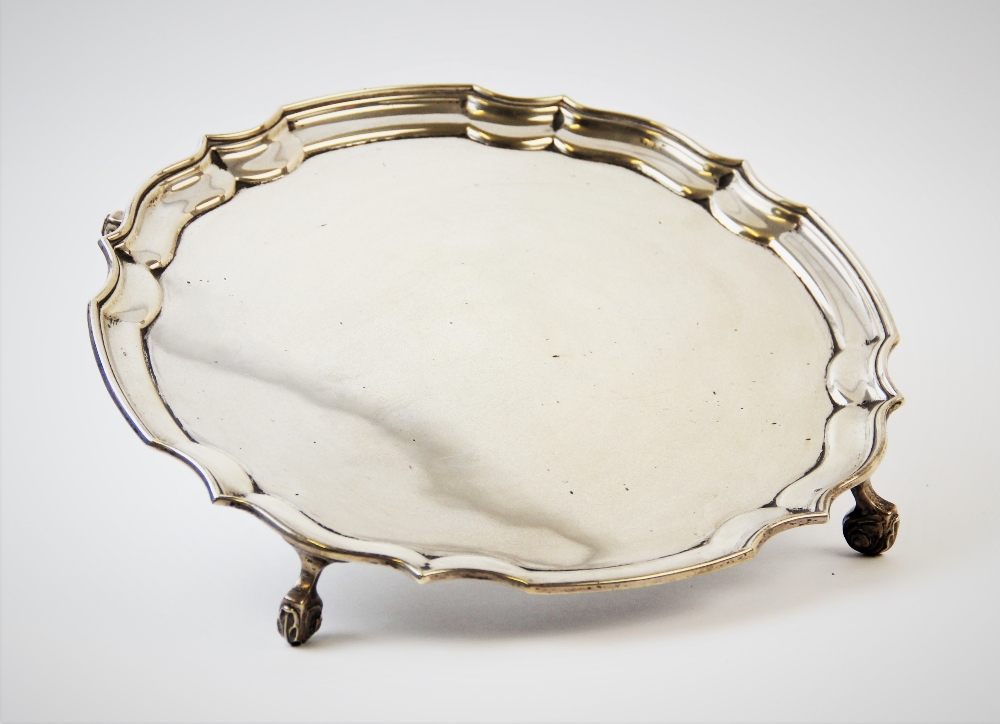 A silver salver, marked for 'T A H', Birmingham 1973, with plain polished bowl, piecrust rim, raised