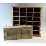 A Victorian pine open pigeon hole cabinet, with twenty four compartments upon a moulded plinth base,