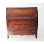 An 18th century French cherry wood bureau, the moulded fall front enclosing an arrangement of