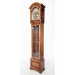A reproduction mahogany cased longcase clock by Interclock, late 20th century, the arched hood