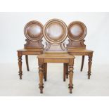 A set of three Victorian oak hall chairs,