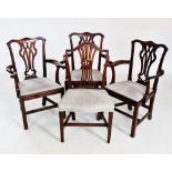 A set of four Hepplewhite style mahogany dining chairs, late 19th century, each with a pierced splat