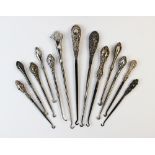 A selection of silver and white metal handled button hooks, Victorian and later (13)