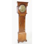 A George III oak cased thirty hour longcase clock by T M, Chesterfield, with a flat top pediment
