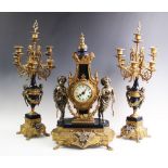 An Italian Brevettato Imperial gilt metal clock garniture, 20th century, the clock adorned with cast