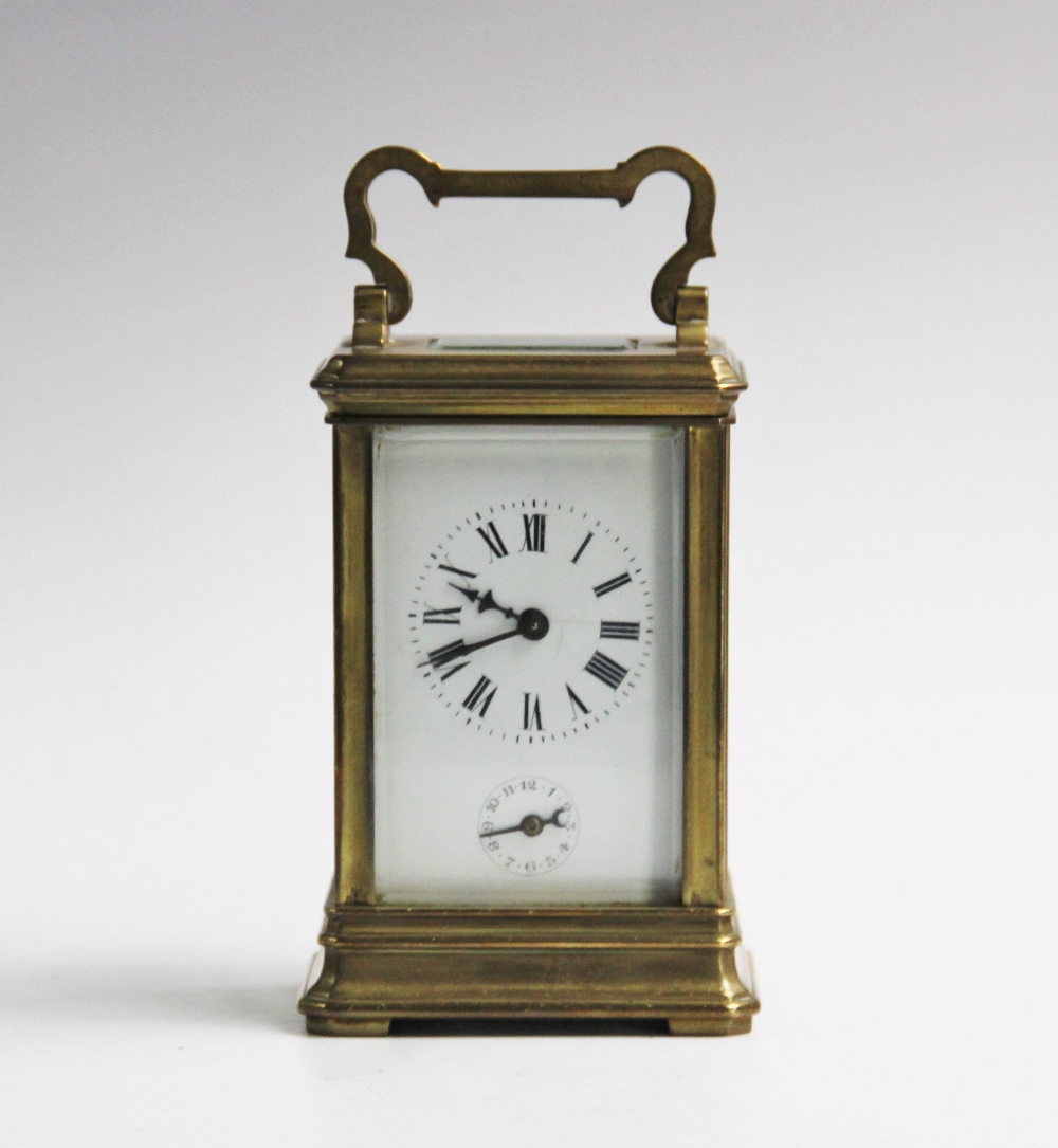 An early 20th century brass cased carriage clock, with a shaped swing handle above the visible - Image 2 of 2