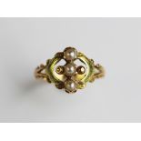 A French gold and seed pearl set ring, designed as three split pearls in a vertical setting,