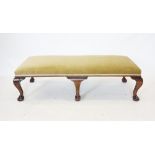 A 19th century style mahogany and upholstered foot stool of country house proportions, the green