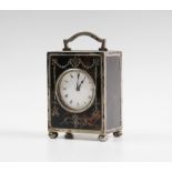 An Edwardian silver and tortoiseshell boudoir timepiece clock, William Comyns London 1910, the white