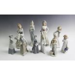 A Lladro figure 'Goya Lady' 32cm high, along with six Nao figures, to include; two children at