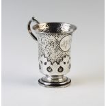 An Edwardian silver christening mug, London 1907, of pedestal form, the body with planished detail