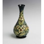 A numbered edition Moorcroft vase of slim baluster form with flared neck, decorated in the '