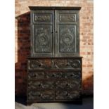 A late 19th century Welsh carved oak secretaire bookcase, with a Greek key pattern frieze above a