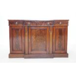 A 19th century mahogany breakfront sideboard, with three frieze drawers applied with gilt metal