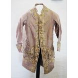 An 18th century frock coat, circa 1770, the lavender silk coat extensively decorated to the lapel,