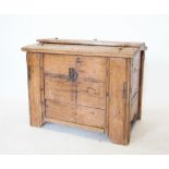 An 18th century Scandinavian pine ark, the hinged sloping lid enclosing a vacant interior, raised