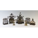 A collection of Menorahs, the majority in brass, to include free standing and wall mounted