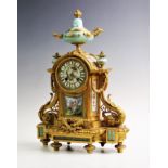 A French 19th century ormolu and porcelain inset 8-day mantel clock, the case of Rococo acanthus and