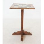 An early 20th century tile top pedestal table, the square top inset with four Art Nouveau tiles,