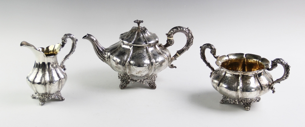 An early Victorian silver three piece tea service, John Wellby London 1840 and 1841, each piece of