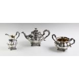 An early Victorian silver three piece tea service, John Wellby London 1840 and 1841, each piece of