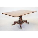 A George IV mahogany tilt top centre table, the rectangular top with rounded corners, raised upon