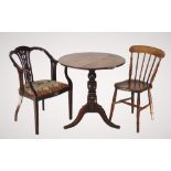 An Edwardian mahogany elbow chair, with a pierced splat back, down swept arms enclosing the
