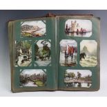 A collection of Edwardian postcards to an album to include topographical interest, greetings cards