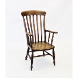A Victorian elm and beech wood farmhouse elbow chair, with a lath back above a shaped elm seat,