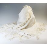 An early 20th century cream shawl with cream silk embroidered detail and fringed border, along