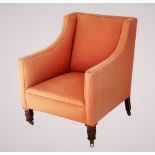 A late 19th century tub chair, with padded down swept arms enclosing a sprung seat, raised upon ring