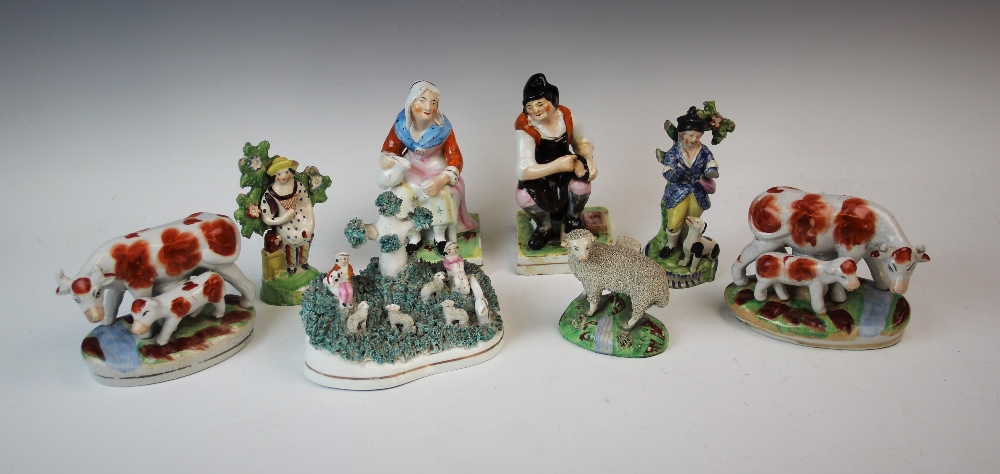 A group of Staffordshire flatback figures, 19th century and later, to include, a figural group of