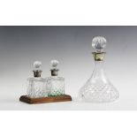 A silver mounted clear glass ships decanter and stopper, Birmingham 1971, 27cm high with a pair of