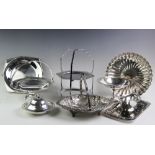 A collection of silver plated serving wares, to include; a Victorian silver swing-handled cake