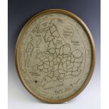 A George III silk embroidered map of England and Wales, of oval form, framed and glazed, 53cm H x