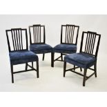 A matched set of four Sheraton style mahogany dining chairs, each chair with a vertical rail back