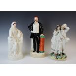 A group of three Staffordshire flatback figures, 19th century and later, comprising: a portrait
