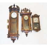 A Victorian walnut Vienna wall clock, the architectural pediment centred with a turned finial