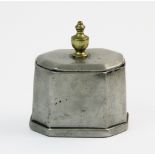 A George III lead tea caddy, of octagonal form, with brass urn shaped finial, the inner cover
