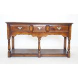 A George III style oak dresser, 20th century, the rectangular moulded top above three frieze drawers