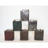 A collection of six vintage petrol cans, including Air Ministry, Pratts, Esso and Shell, some
