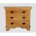 A Victorian pine chest of drawers, the bow front top above two short and two long drawers applied