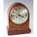 A 1920's Kienzle mahogany cased bracket clock, of lancet form with an 18cm silvered dial applied