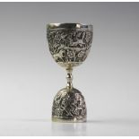An Anglo-Indian silver double egg or wager cup, each bowl chased with a continuing landscape of