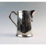 A silver plated ewer, possibly American, the ewer of plain polished design with loop handle and
