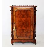 A Victorian burr walnut music cabinet, the quarter veneered top with a gilt metal open work gallery,