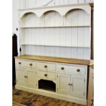 A Victorian style painted pine kitchen dresser, 20th century, the high back with an arcaded frieze